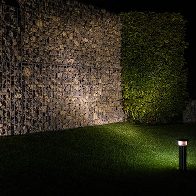Vole Light with Spot bulb illuminating a stone wall